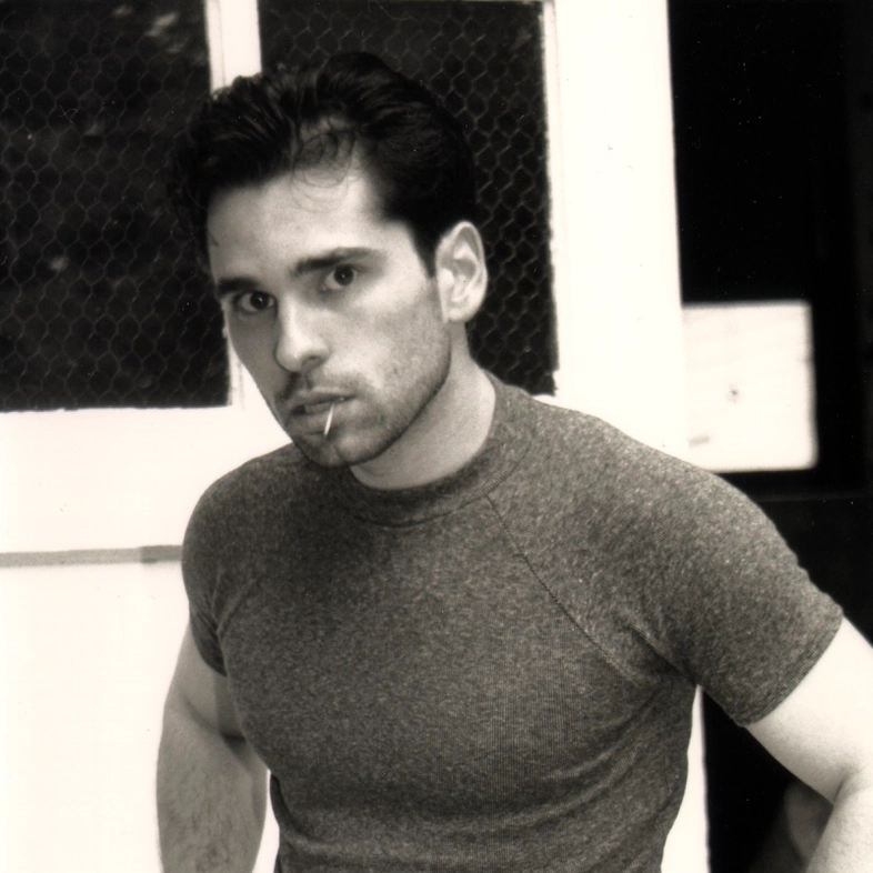 Black and white professional headshot of a young Paul Vinger with a toothpick